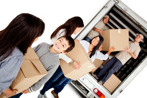 Man with van loading furniture for a Bromley home removal