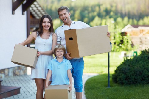 Furniture being carried from a Bromley flat during a man and van removal