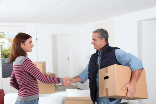 Packed moving boxes and furniture ready for transport in Bromley